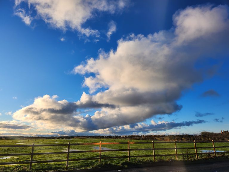 Blue skies with fluffy white clouds